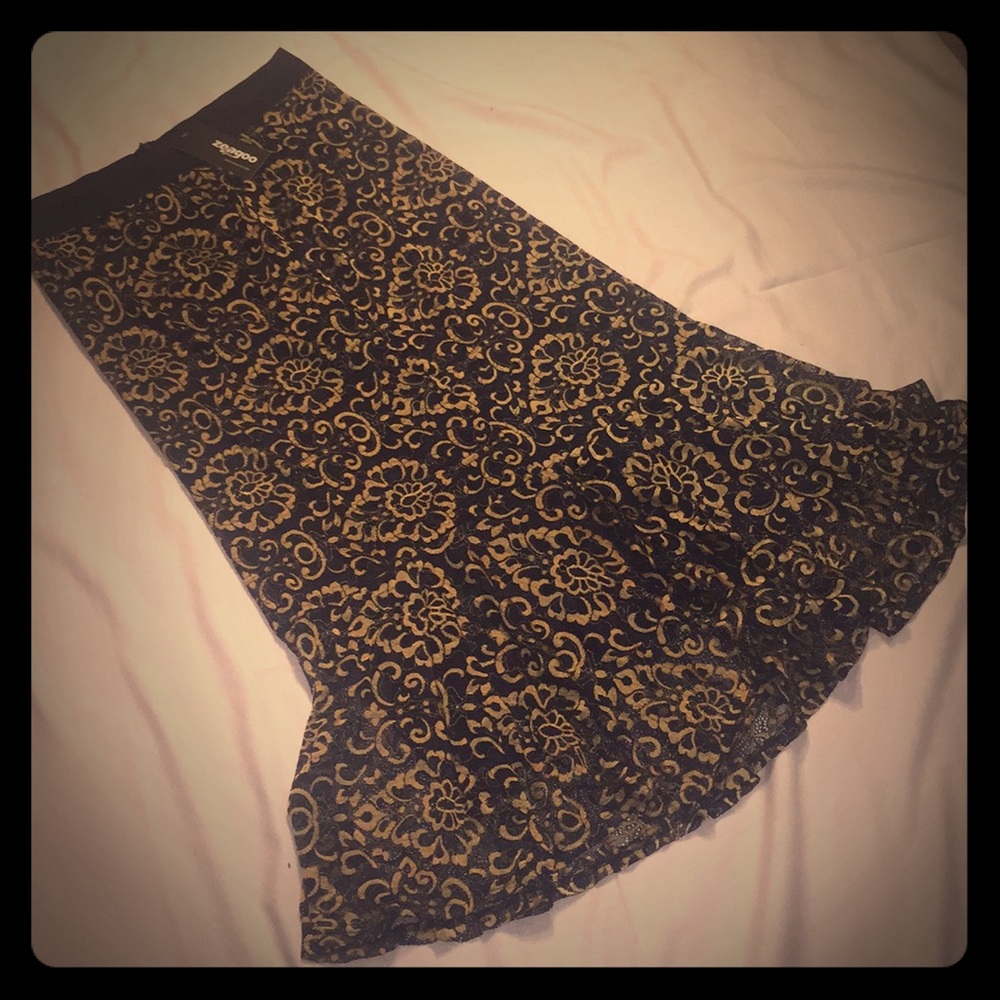 NWT navy and gold lace skirt with a ruffle hem.